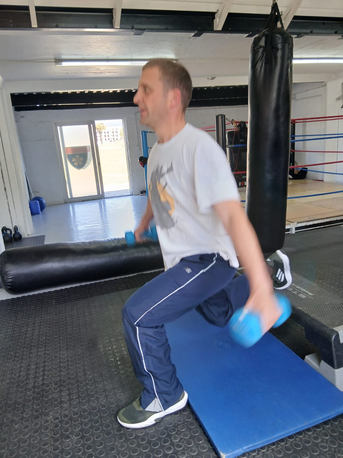 1-on-1 boxing training — lunges exercise at Iron Fists Academy
