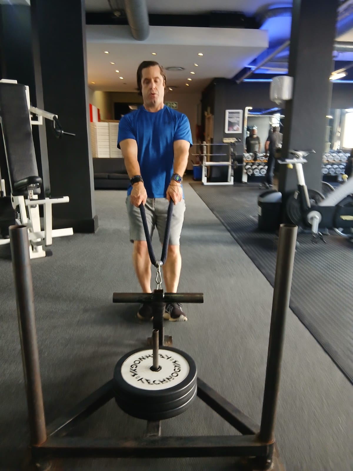 1-on-1 boxing training — athlete pulling weighted sled at Iron Fists Academy